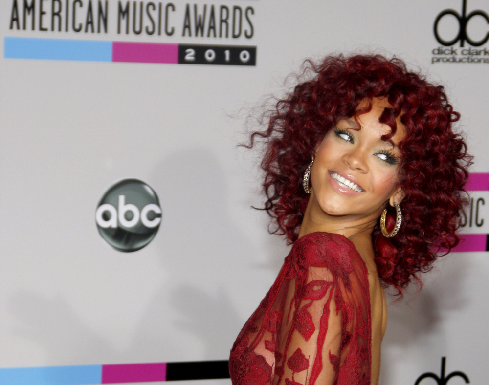 rihanna red hair long curly. Rihanna red dress curly hair
