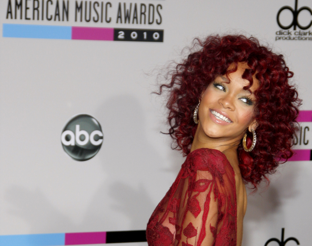 Rihanna red dress curly hair 50 Beautiful Rihanna Photos 2010