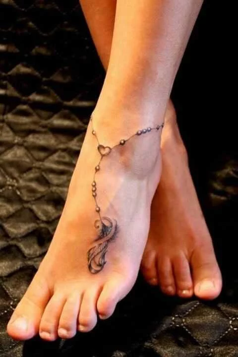 Ornamental anklets tattoo
